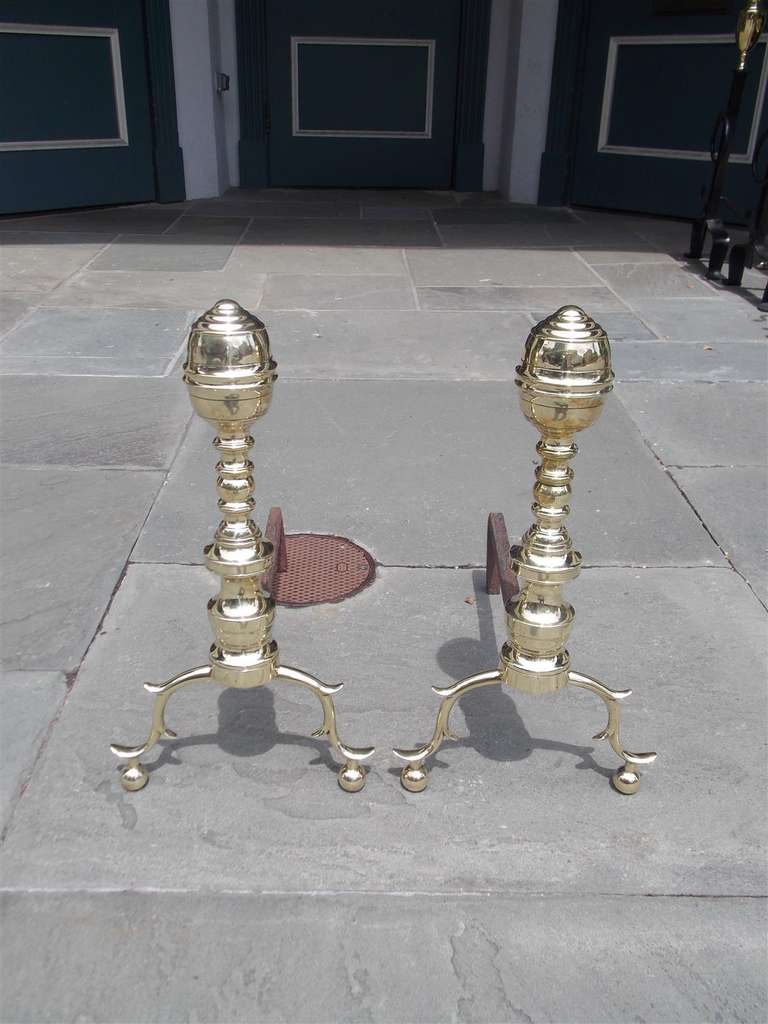 Pair of American elongated lemon top andirons with turned bulbous plinths and terminating on double spur legs with ball feet. Early 19th Century.  NY