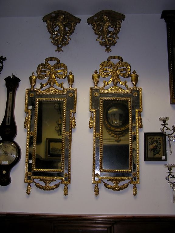 Neoclassical Pair of Italian Gilt Carved Floral Wall Mirrors. Circa 1780 For Sale