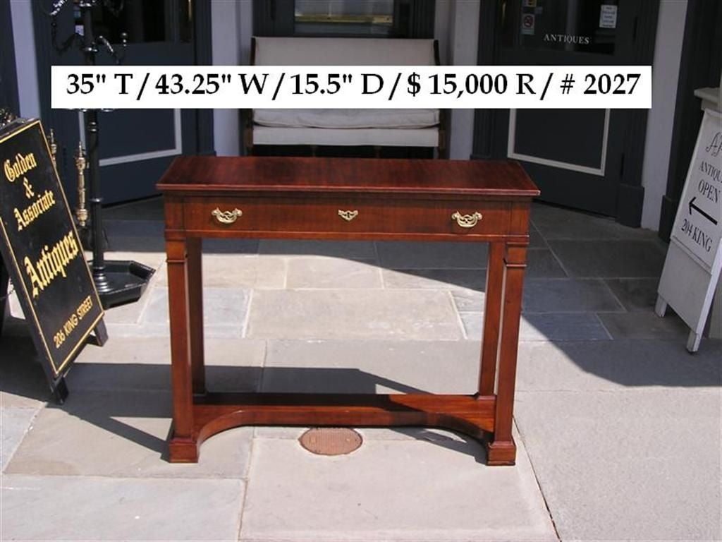 English mahogany one drawer diminutive console with carved molded edge,  original brass pulls, lower horizontal base, and terminating on Marlboro feet. Early 19th Century