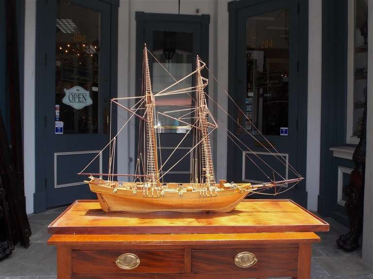American frigate ship mounted on pecky birch board with original rigging and brass cannons. Late 19th century.