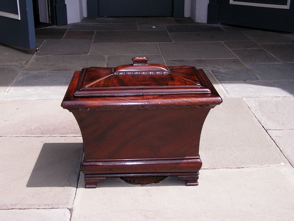American mahogany cellarette with gadrooned molded edge, egg & dart carving, inserted copper liner with rope motif, and terminating on the original ogee bracket feet. Late 18th Century