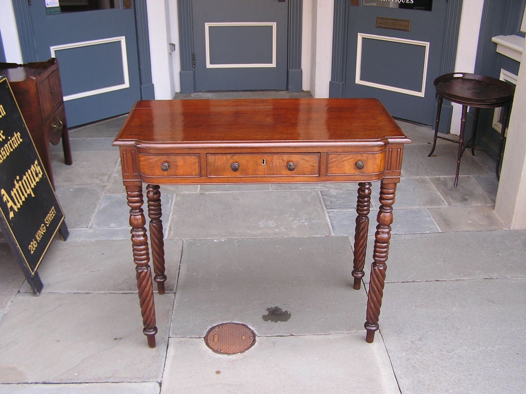 Jamaican mahogany server with a carved molded edge one board top over a center drawer flanked by matching faux drawers , original wood knobs, and terminating on barley twist turned bulbous ringed legs. Early 19th Century