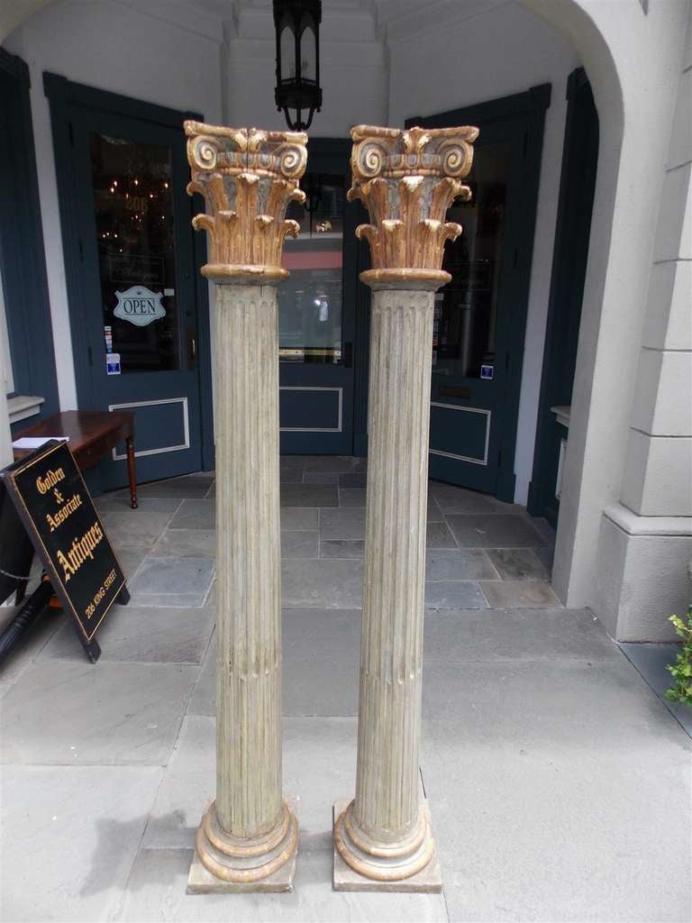 Pair of Italian gilt carved wood and painted Corinthian fluted columns. Late 18th Century
