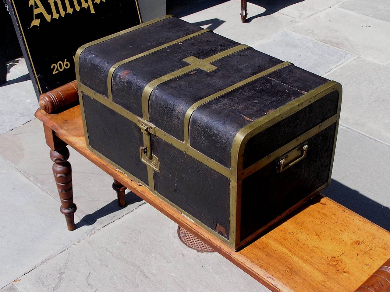 British Campaign water proof leather traveling trunk with leather fitted interior compartment, brass banding mounts, Royal coat of arms brass plate, brass side handles, and retains the original locking mechanism. Trunk retains the original paper