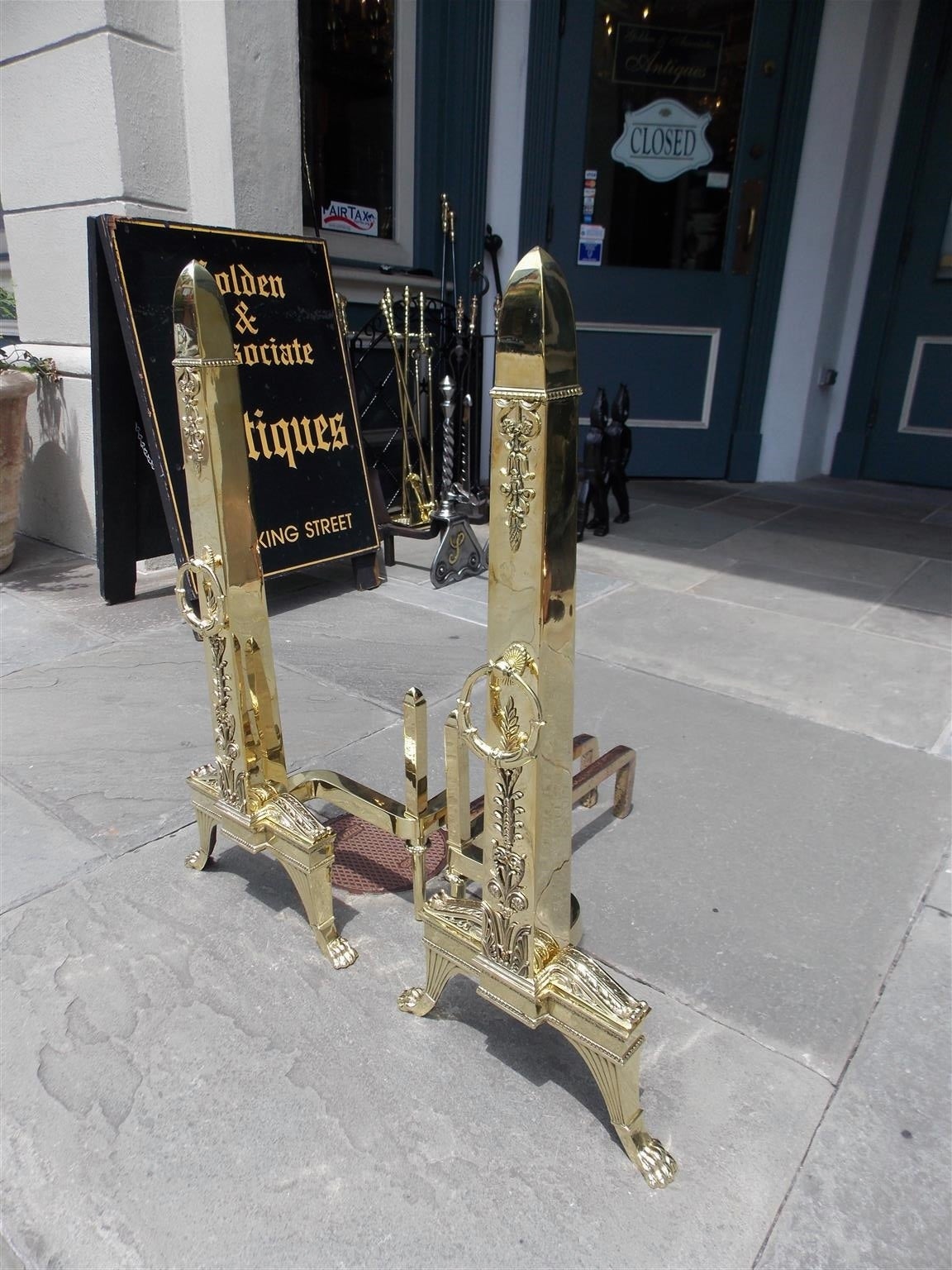 Cast Pair of Monumental French Brass Obelisk Acanthus Floral Andirons. Circa 1830 For Sale