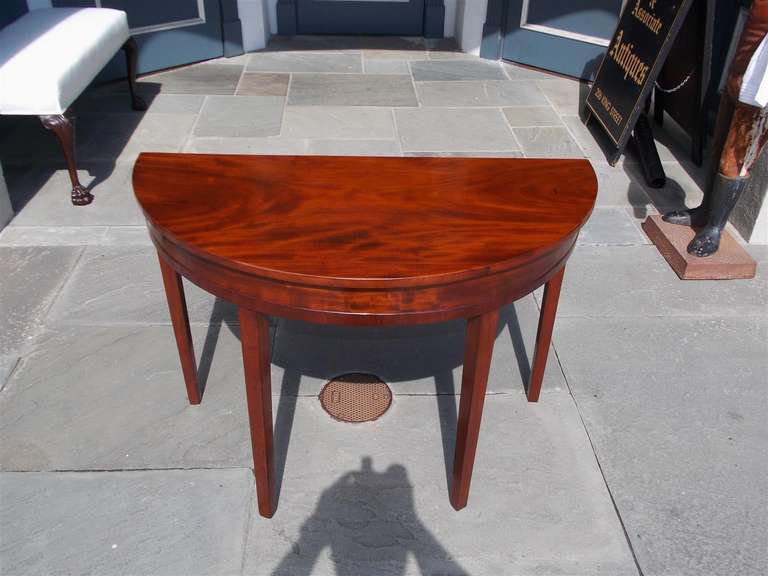 American mahogany single demi-lune table with tapered legs. Late 18th Century