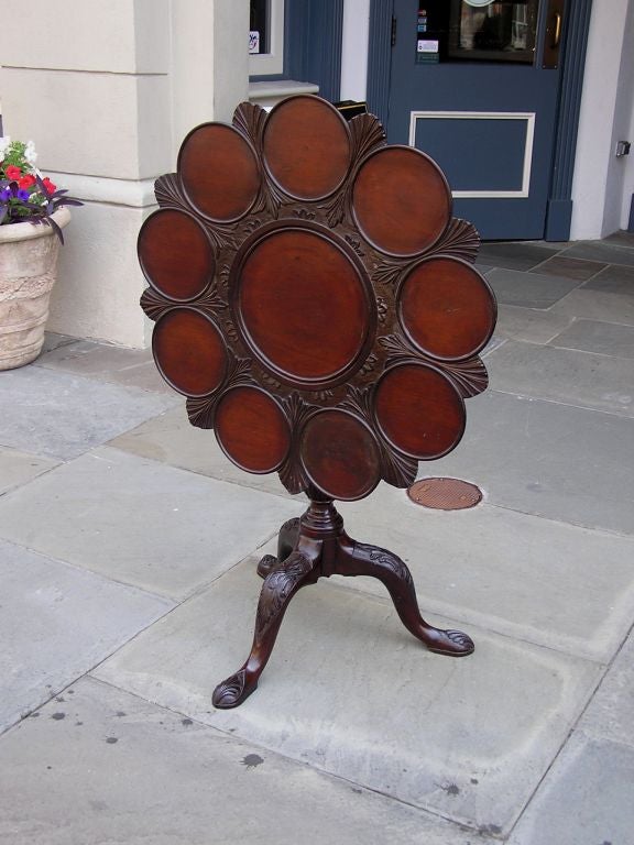 English Chippendale mahogany tilt top desert  table with rotating bird cage, acanthus carved bulbous pedestal knee, and terminating on shell carved pad feet. Dealers please call for trade price