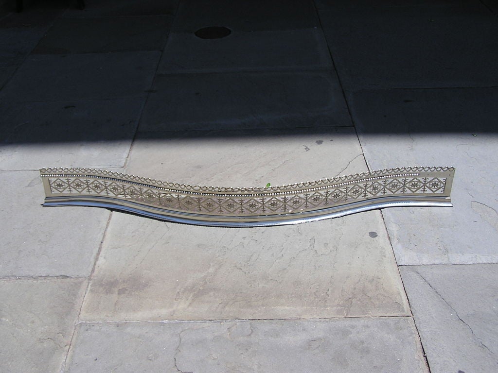 English Paktong serpentine fire fender with hand chased diamond engraving,  pierced gallery, single row of beading, and resting on a molded edge. Mid 18th Century