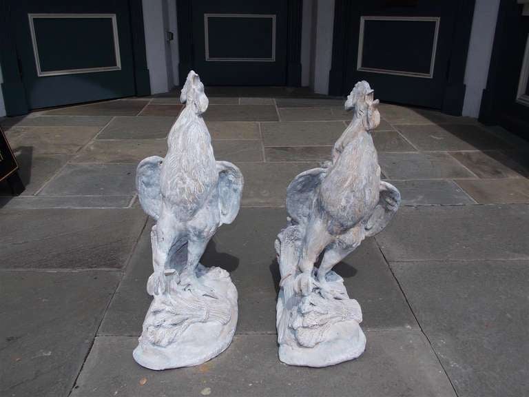 Pair of French perched lead roosters. Dealers please call for trade price.