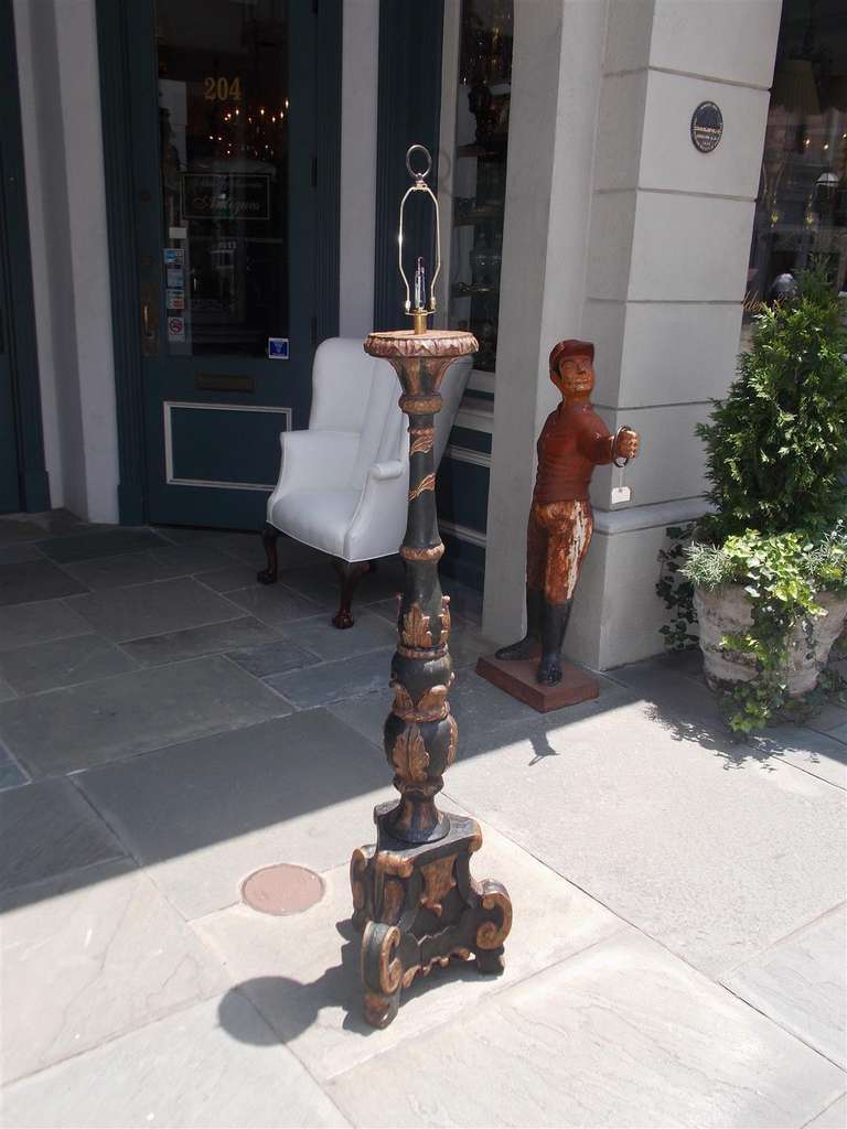 Italian painted and gilt torchiere with decorative floral motif terminating on tripod base. Originally candle and has been converted and electrified into floor lamp. Late 18th Century