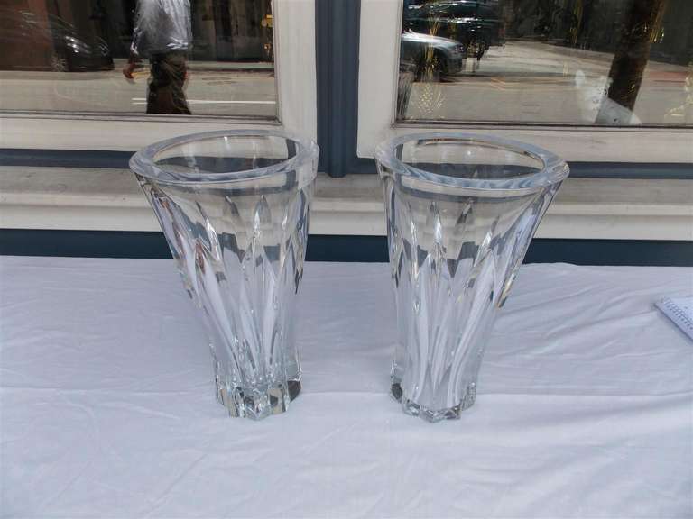 Pair of Baccarat crystal vases with faceted flared form. Early 20th Century