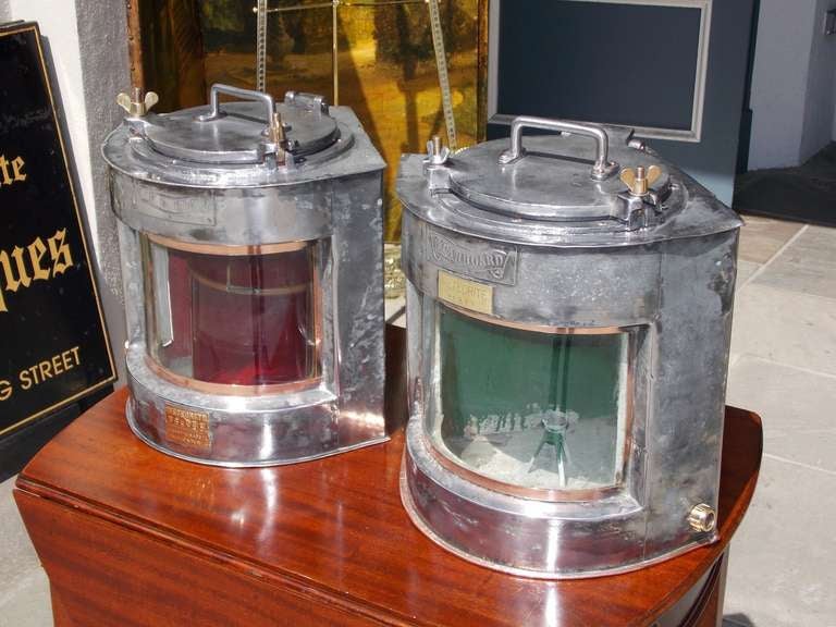 Pair of English polished steel ship lanterns. Signed by maker , Meteorite and stamped Port and Starboard.  Dealers please call for trade price.