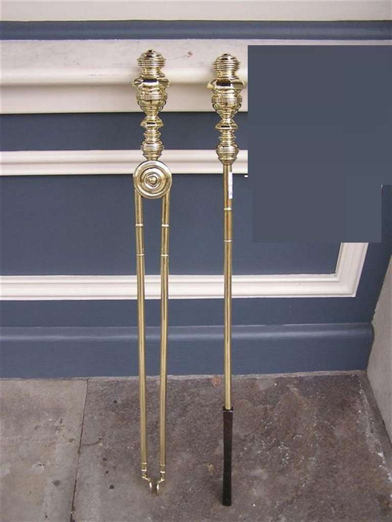 Monumental pair of American Period fire place tools with turned bulbous faceted finials. Pair consist of Tong and poker. Early 19th Century