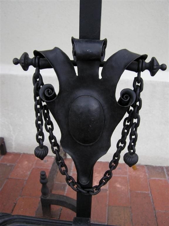 Early 19th Century Pair of American Wrought Iron Shield Andirons with Decorative Crossbar, C. 1820 For Sale