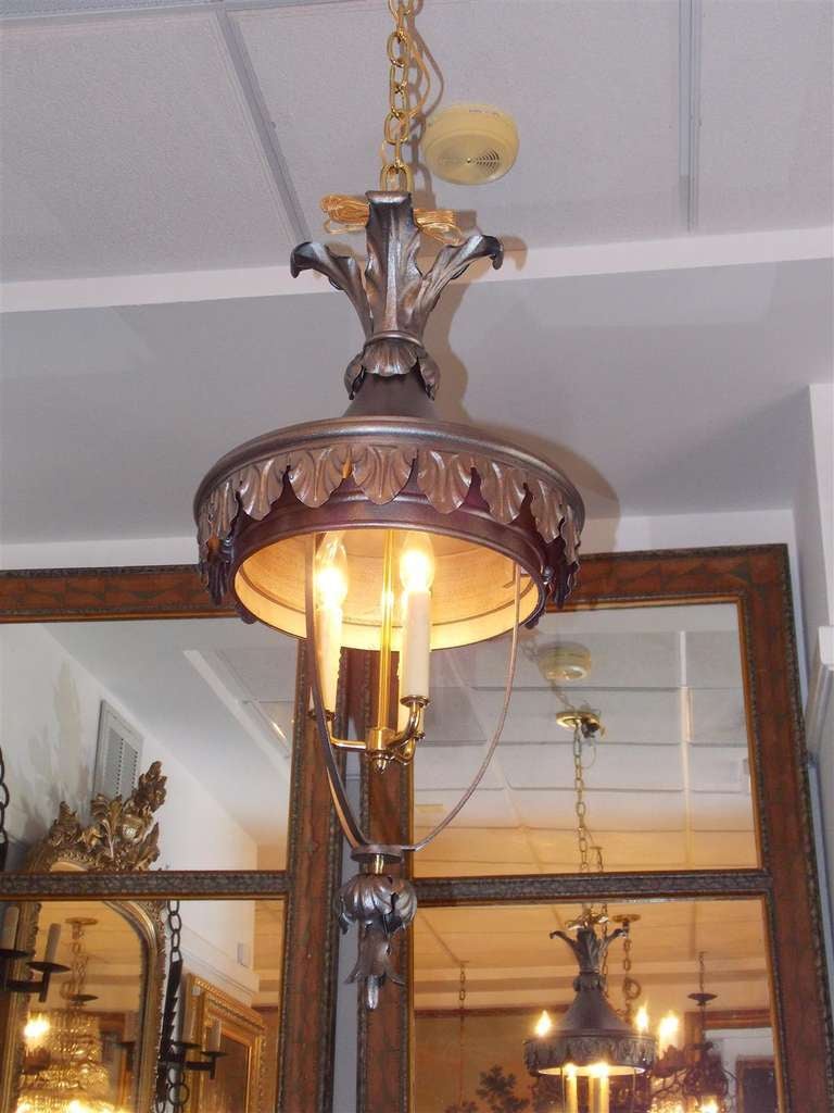 Italian three light polished steel and brass hanging lantern with floral decorative motif terminating with lower centered floral pistil.  Originally candle powered.  Dealers please call for trade price.