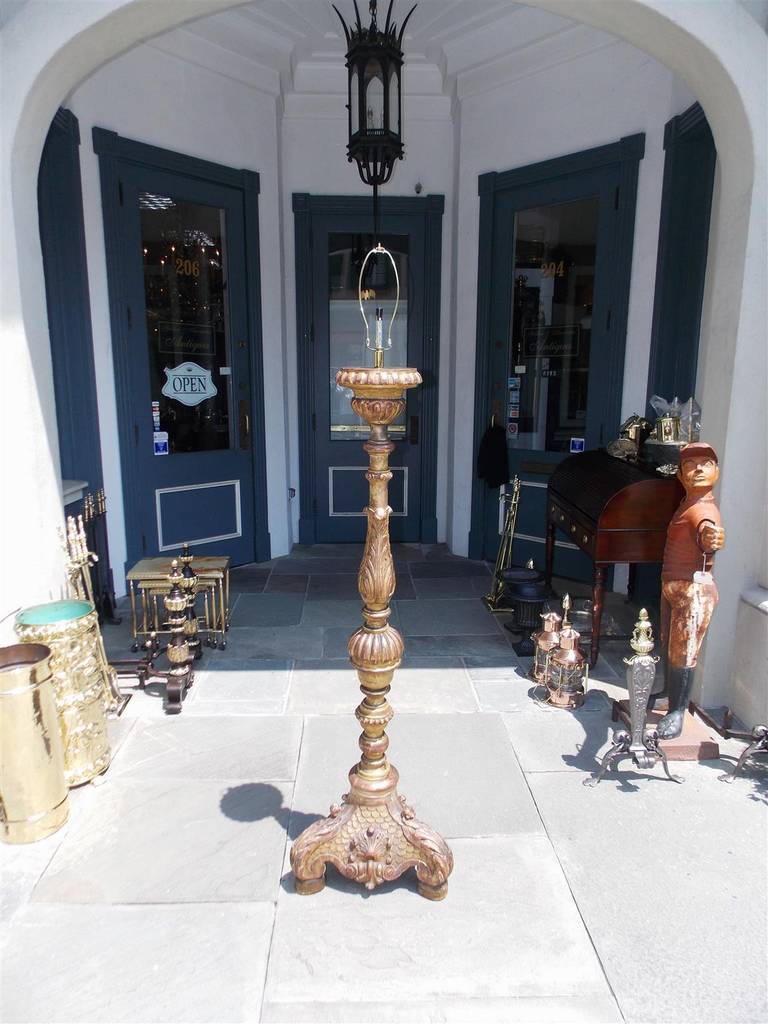 Italian gilt and red lacquered bulbous torchiere with acanthus floral and shell motif terminating on tripod base. Originally candle powered and has been electrified. Piece has been converted into floor lamp. Late 18th Century