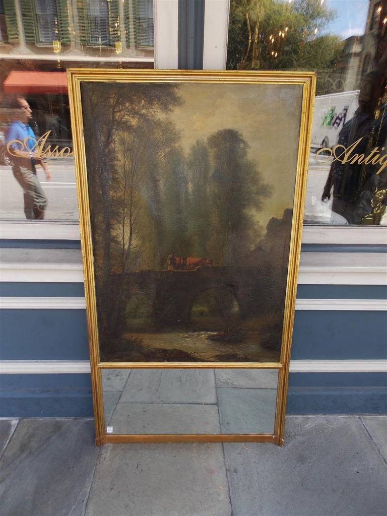 French gilt trumeau mirror with original landscape oil on canvas depicting cows on bridge with running stream below.  Signed by artist L. Dalpay.  Mirror has the original glass and backing. Early 19th Century
