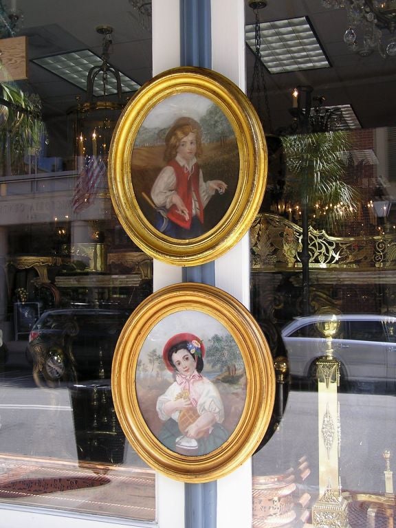 Pair of English Pastels of boy and girl with original gold gilt frames.