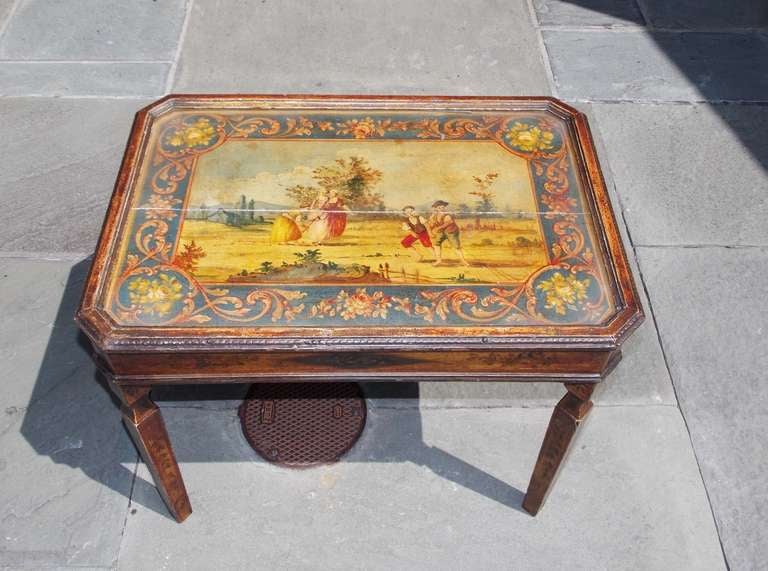 Italian carved wood, painted , and gilt tea table with decorative landscape  under glass top.  Dealers please call for trade price.