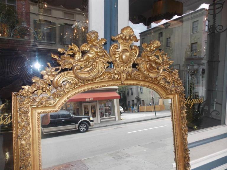 French Gilt Carved Wood Floral and Cherub Wall Mirror.  Circa 1790 In Excellent Condition For Sale In Hollywood, SC