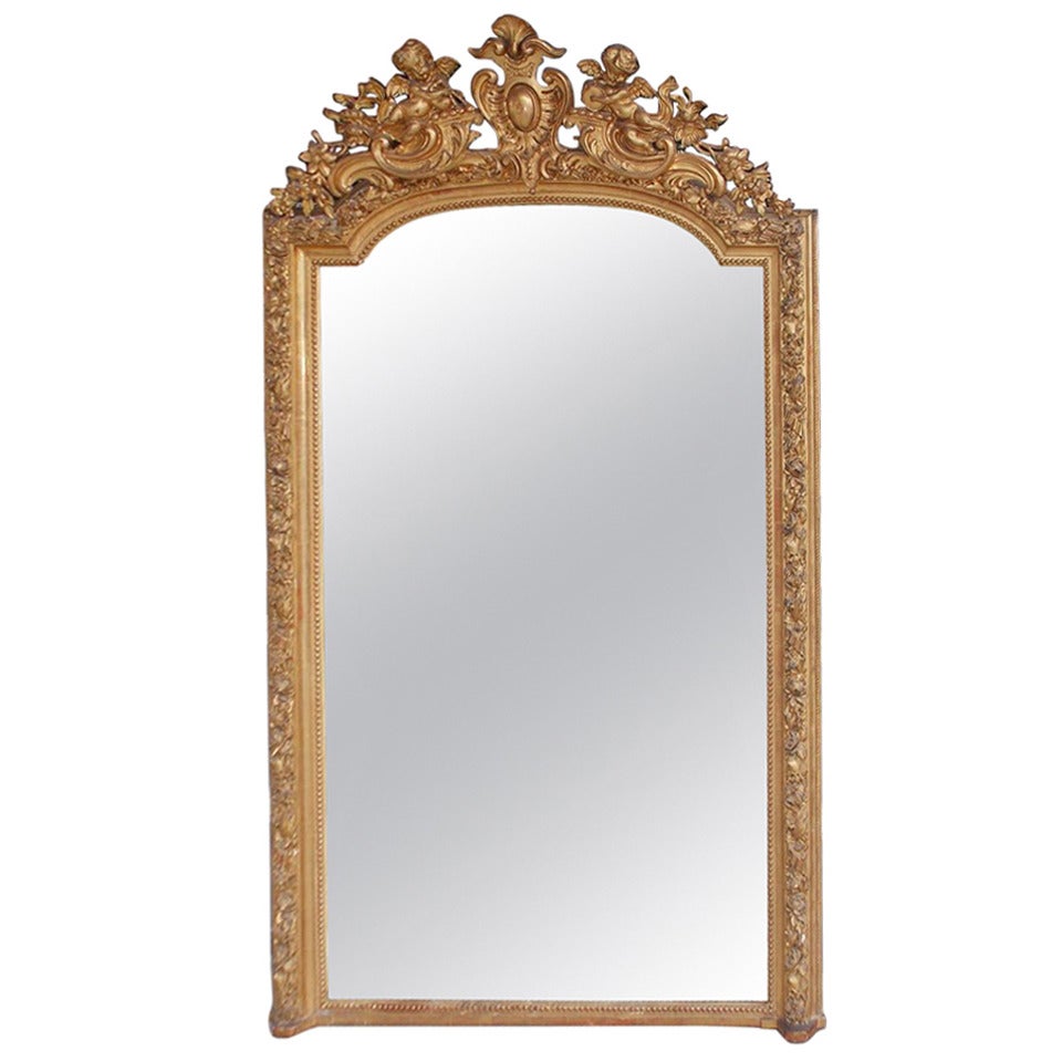 French Gilt Carved Wood Floral and Cherub Wall Mirror.  Circa 1790