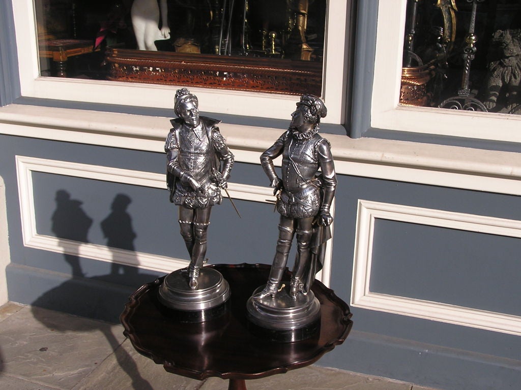 Cast Pair of English Spelterware Cavaliers Mounted on Ebonized Circular Bases. C.1900