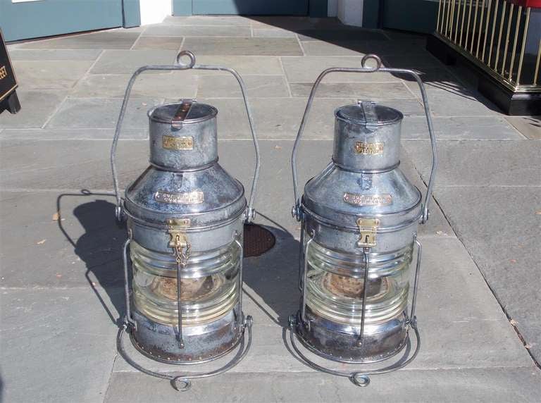 Pair of English polished steel and brass ship lanterns. Signed by maker , Meteorite.  Dealers please call for trade price.