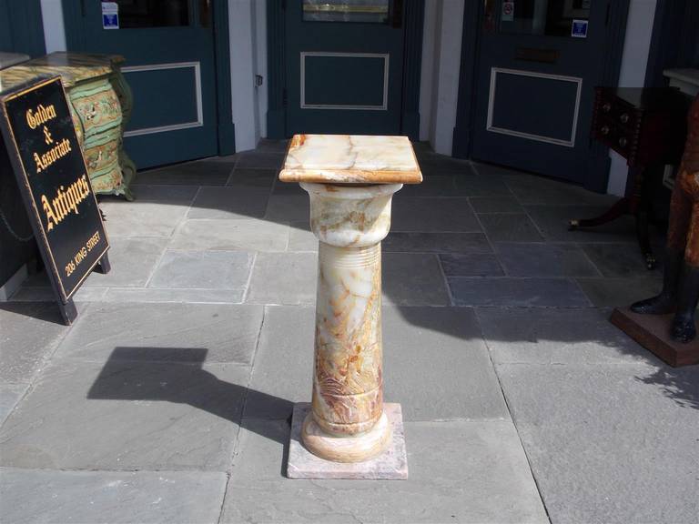 French onyx bulbous pedestal with squared plinths. Late 19th century.