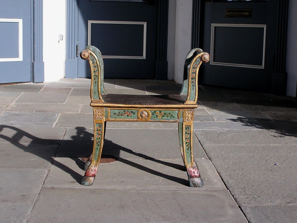 Italian hand carved and floral painted window bench with scrolled arms, saber legs, and ending on hoof feet. 18th Century