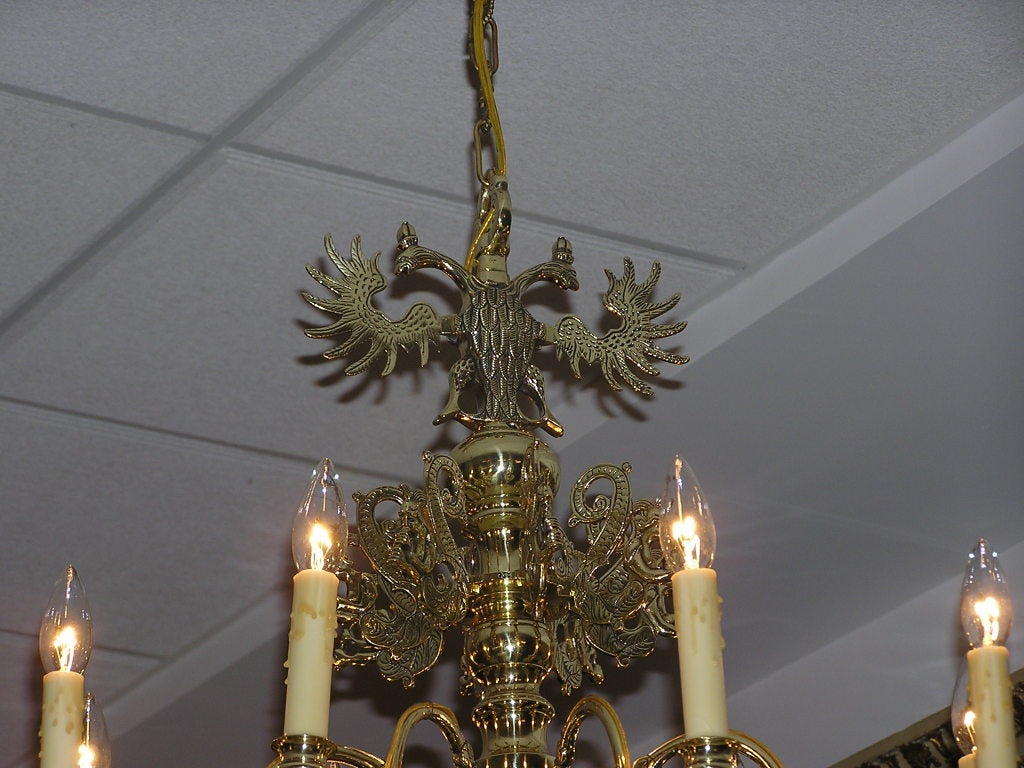 Cast Dutch Colonial Brass Sixteen Arm Chandelier with Engraved Double Eagles, C. 1760