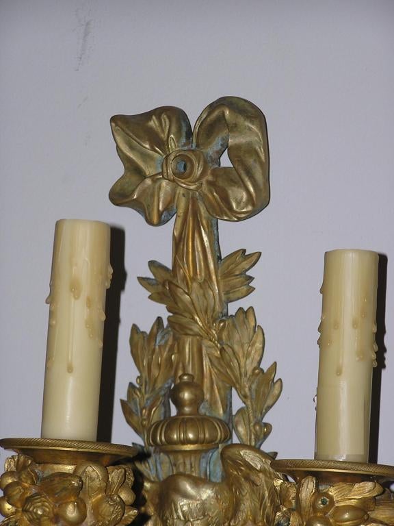 Pair of Italian Gilt Bronze Ormolu Ribbon & Foliage Three Arm Sconces. C. 1820 In Excellent Condition For Sale In Hollywood, SC
