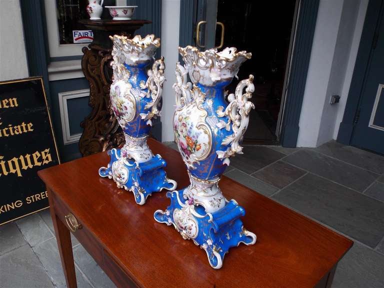 Pair of French Old Paris vases with painted, gilt, and  figural floral decorative scenes.  
