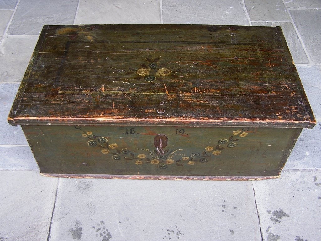 American White Pine hand painted floral blanket chest with original wrought iron strap hinges, interior till, and locking mechanism with key. New York, Early 19th Century