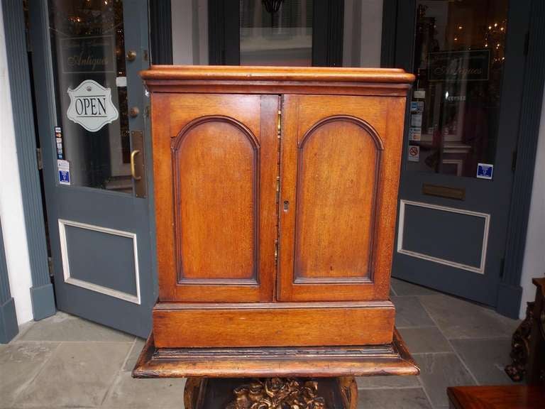 English mahogany two door campaign medical box opening to reveal three drawers with original recessed brasses.  Circa 1830