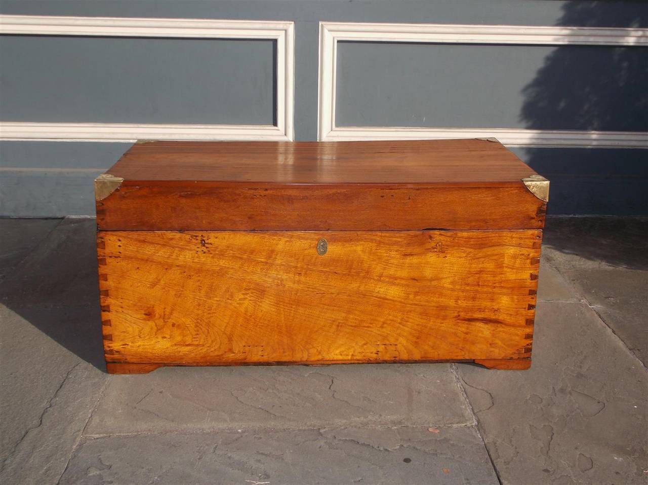 Dutch camphor wood Campaign trunk with exposed dove tails, interior till,  exterior heart shaped brass mounts, and original brass side handles. Late 18th Century.