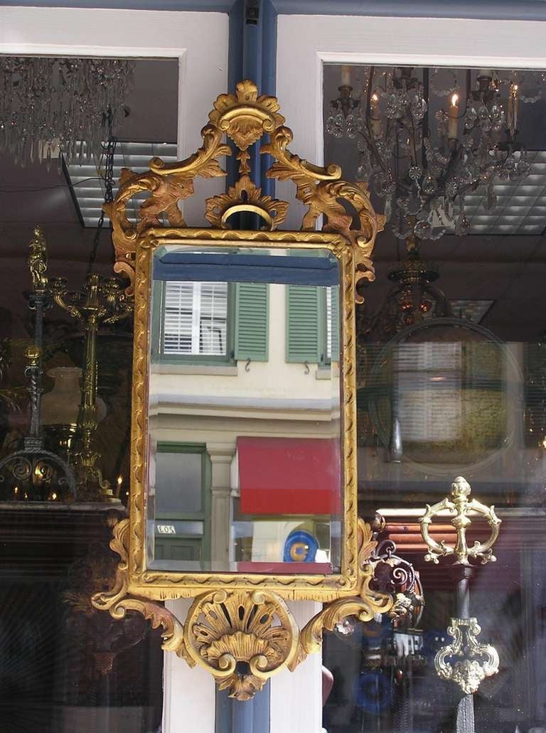 English Chippendale gilt carved wood and gesso mirror with acanthus floral and shell motif.  Mirror retains the original glass. Late 18th Century