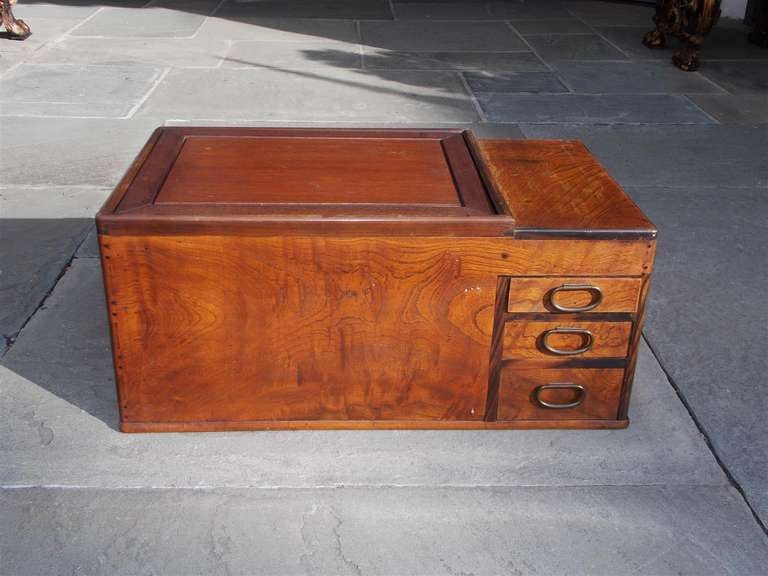KYOTO STYLE NAGA HIBACHI (FIREBOX BRAZIER GRILL), Japanese, Meiji Period, The rectangular hibachi is of Keyaki (Zelkova) wood construction with the original copper liner, and a column of three small drawers set to the right with the original lid. 