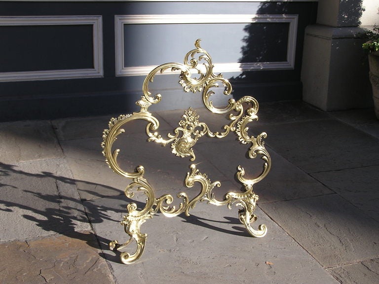 French brass Rococo free standing fire screen with scrolled floral motif. Dealers please call for trade price. 