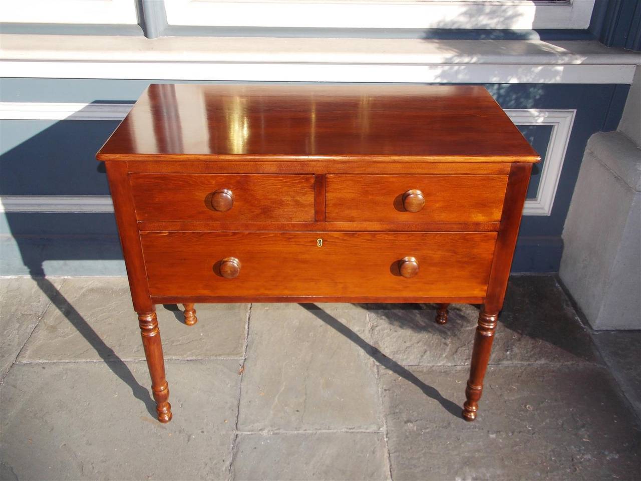 American Sheraton pine three drawer server with wooden knobs and turned bulbous legs.  Early 19th Century
