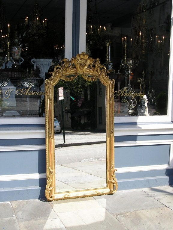 Louis Philippe French Gilt Wood & Gesso Foliage Swag Medallion Crest Cherub Wall Mirror, C 1810 For Sale