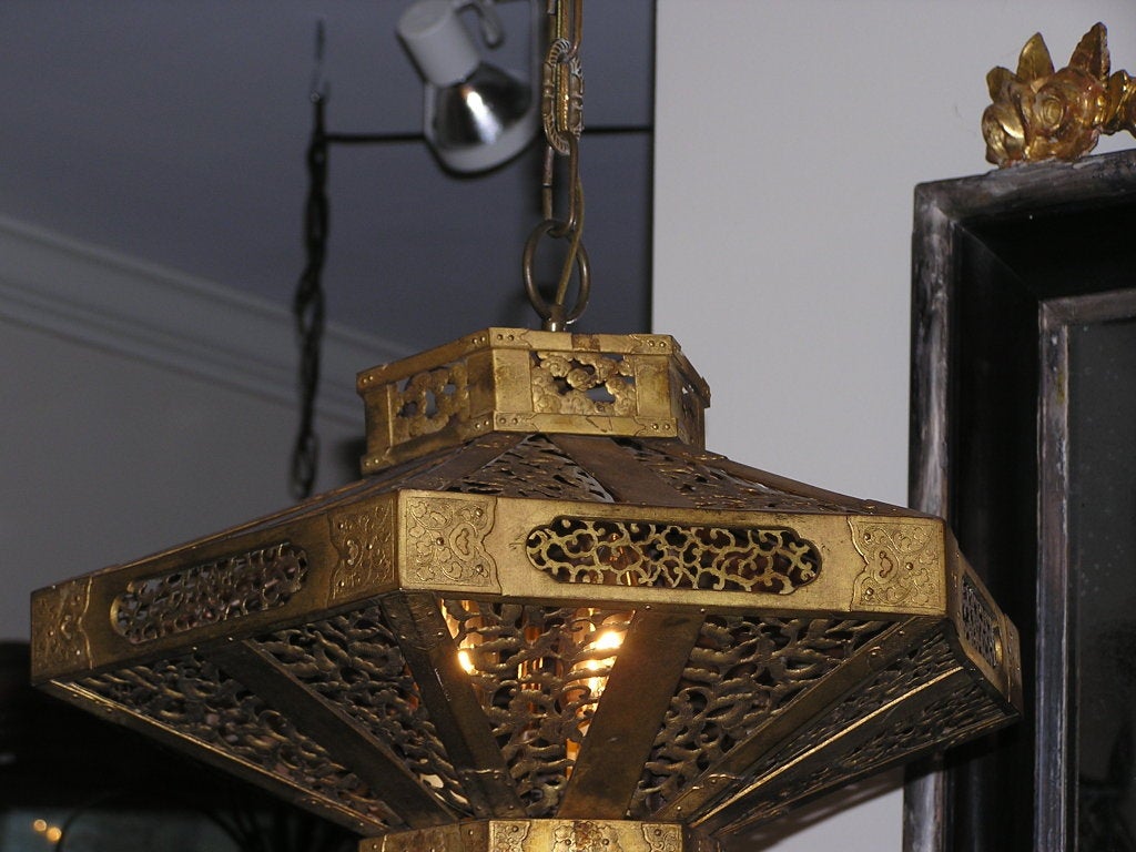 Japanese Pagoda gilt bronze hanging lantern with filligree, hand chase work, and floral motif. Originally candle powered.