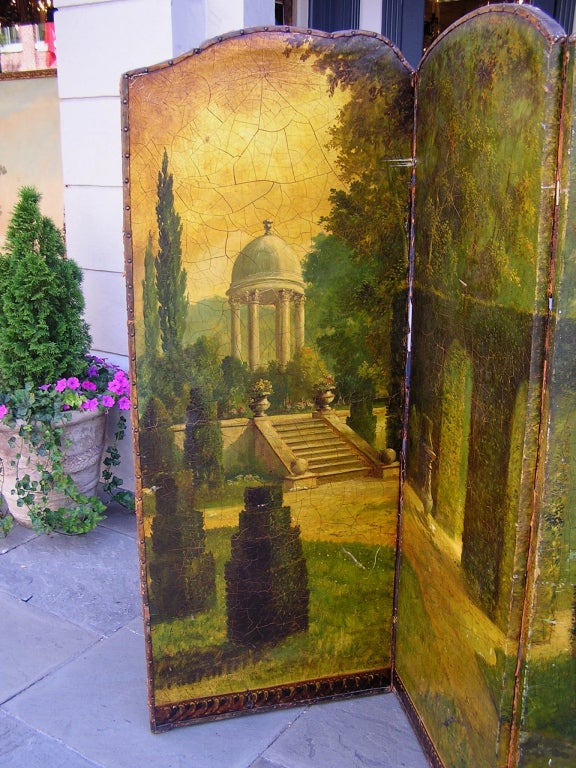 Italian three panel leather screen with scrolled top, hand painted landscape and garden scene.  Dealers please call for trade price.