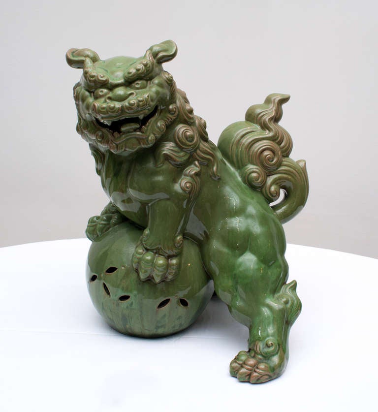 A fine large Japanese Kutani foo dog, circa 1900. The foo dog is glazed in a vibrant green.