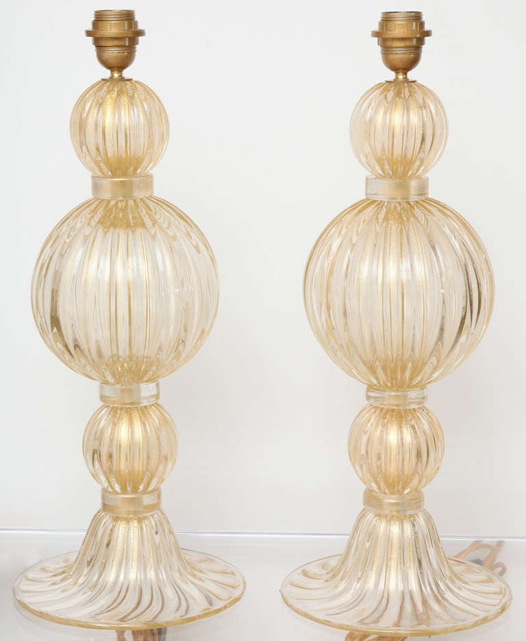 Beautiful pair of heavy Murano avventurina glass table lamps in the style of Barovier. Base is 7.5