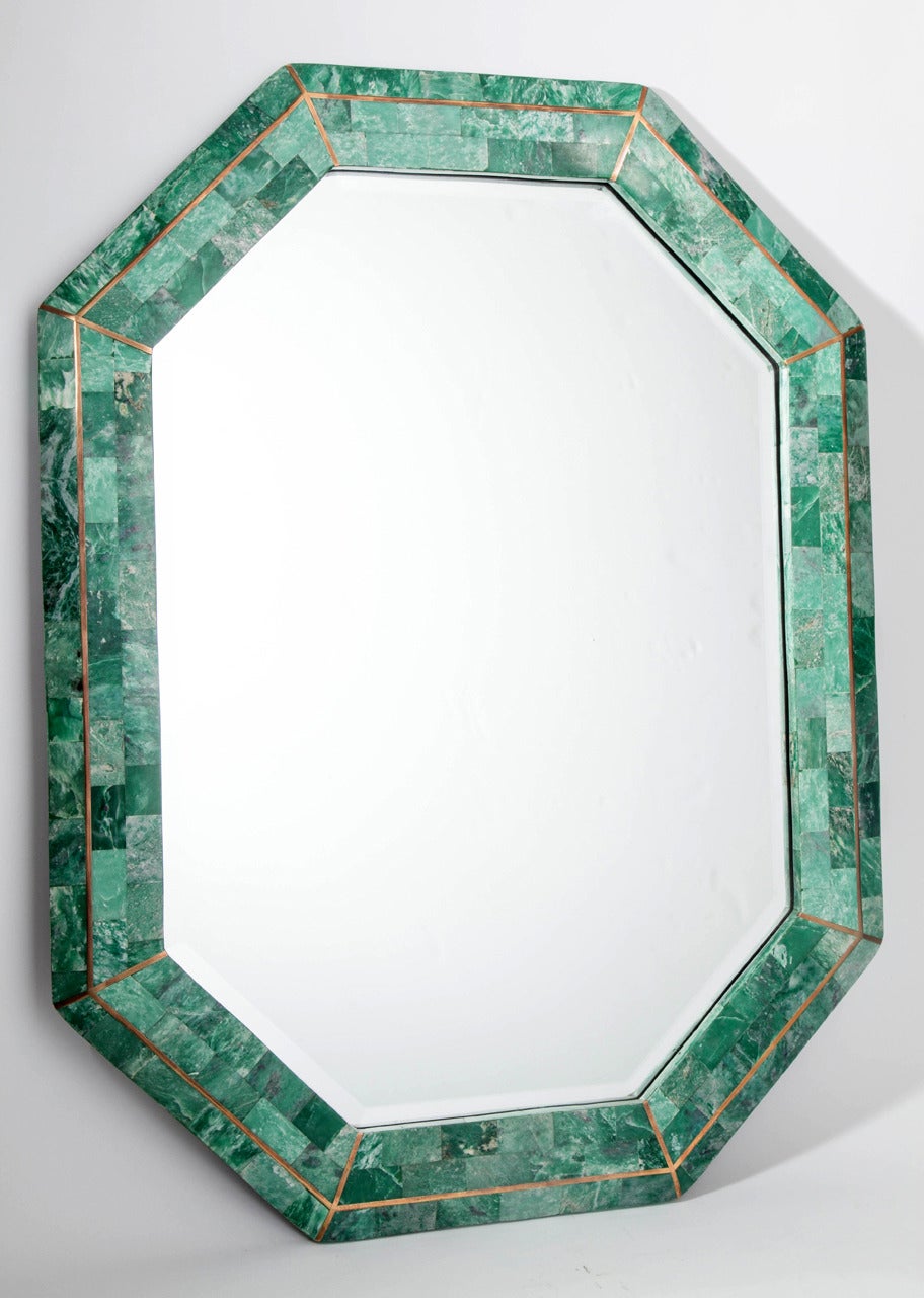 Striking tessellated stone octagonal mirror in a gorgeous malachite green color with polished brass inlays. This mirror was designed by Robert Marcius and manufactured by Maitland-Smith for Casa Bique between 1984-1986. Signed by Maitland-Smith with