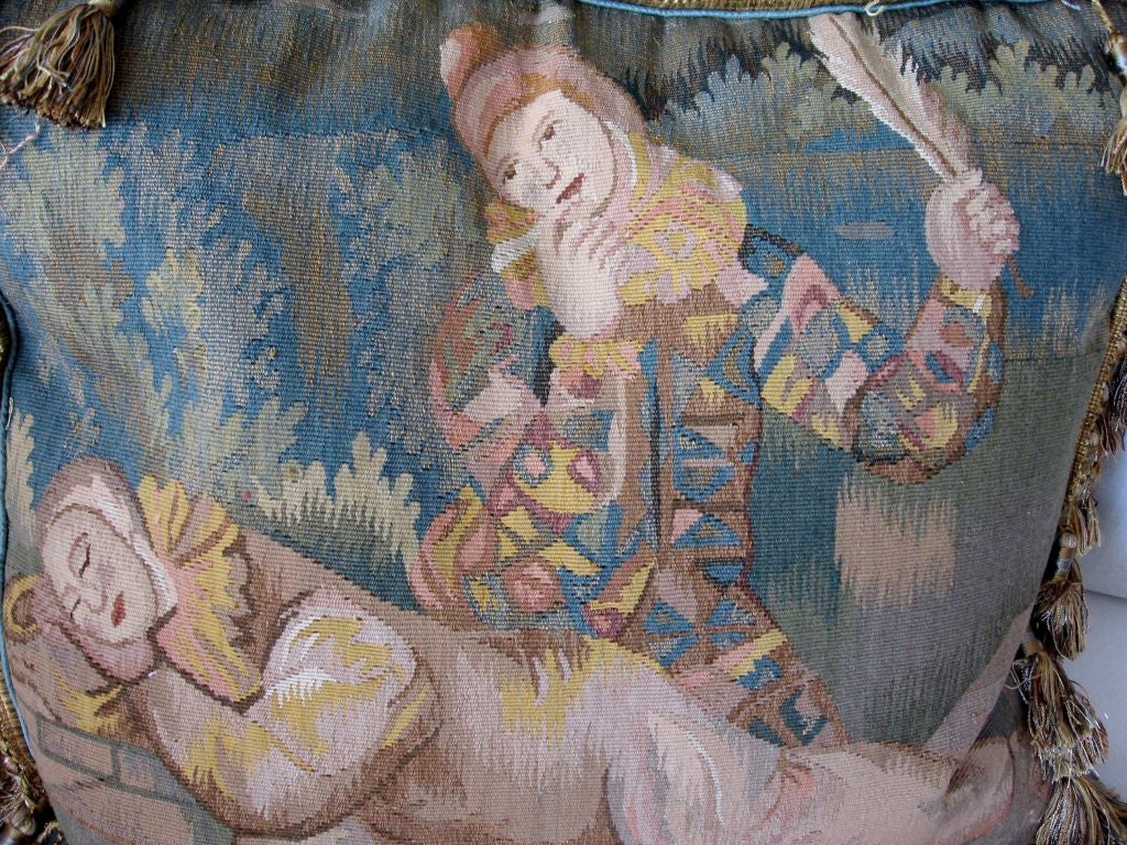 These heavy, handmade tapestry pillows are in the most beautiful hues of turquoise, gold, cream with a hint of peach.  The scene depicts two music jesters. Raw silk back and zipper closure with silk gold and turquoise tassels.  Down insert included.
