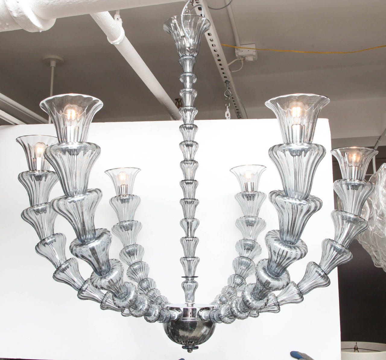 Very unique vintage silver or pewter gray Murano glass chandelier with six arms in the manner of Barovier and Toso. Individual handblown elements that surround each arm give this chandelier an organic feel and look.  Chrome frame.  Rewired for the