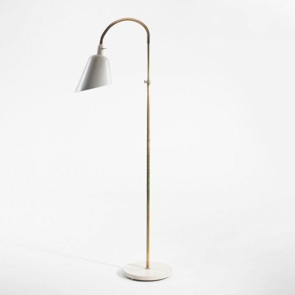 Early (and becoming quite rare) adjustable floor/reading lamp designed by Arne Jacobsen (Denmark, circa 1929) for Louis Poulsen in white enameled metal with brass stem. In excellent working order. Literature: Arne Jacobsen, Thau and Vindum, pg. 11.