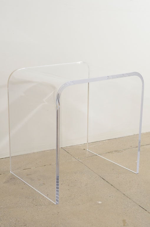 Classic and timeless waterfall design. These lucite tables are made of thick 3/4