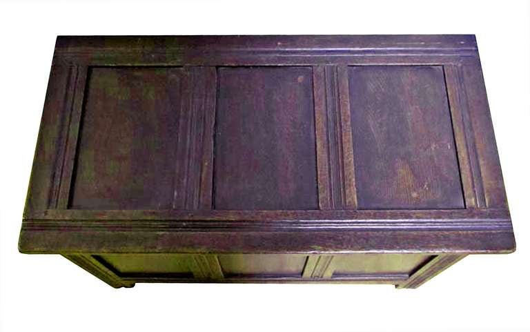 rectangular paneled top with an open interior; raised on stile feet.